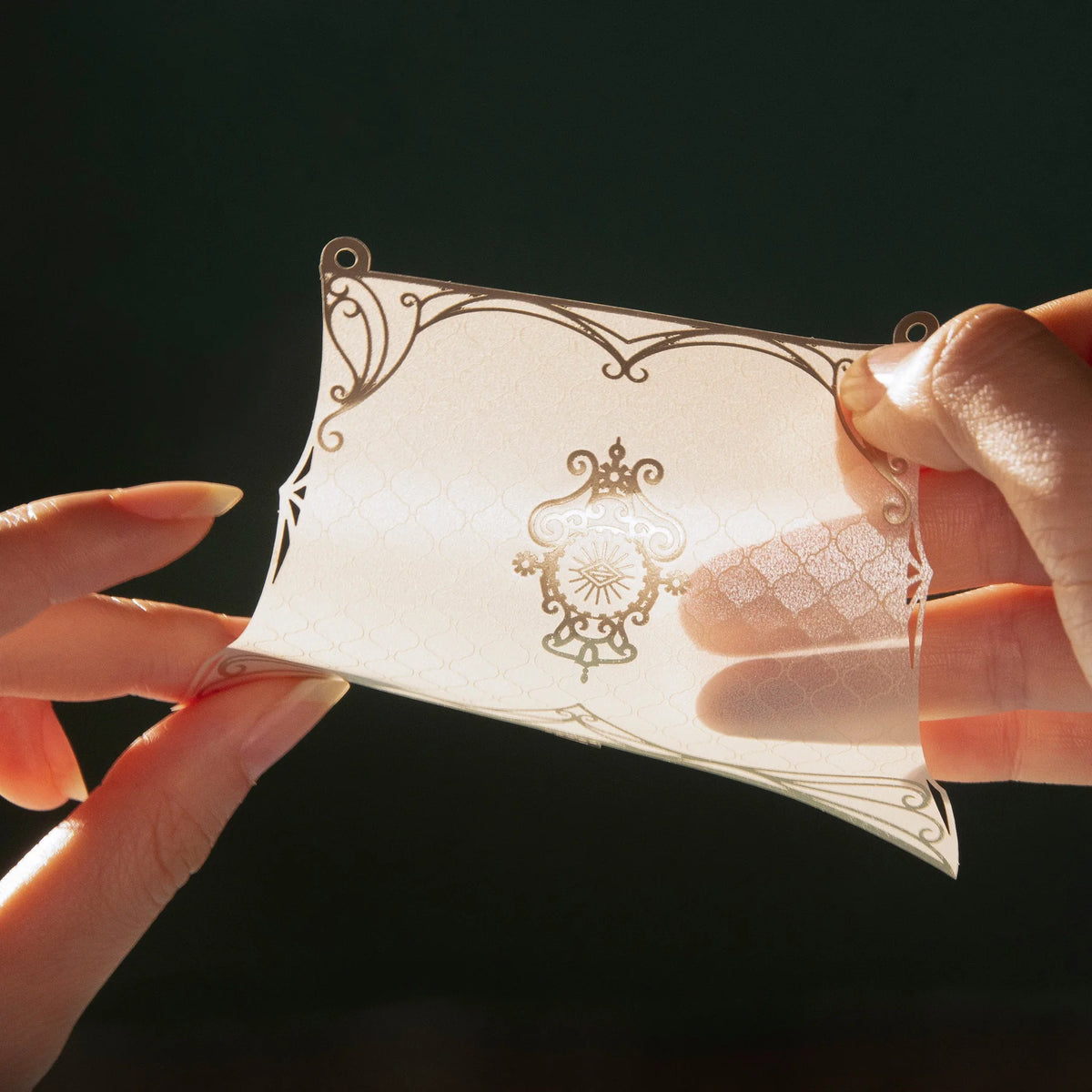 Close-up of a translucent Fantasy Elfship sail with decorative gold patterns